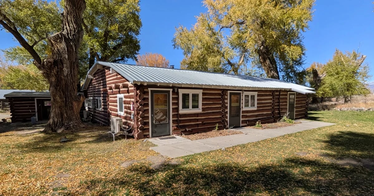 Zapata Ranch cabin near Alamosa with stained logs and light chinking