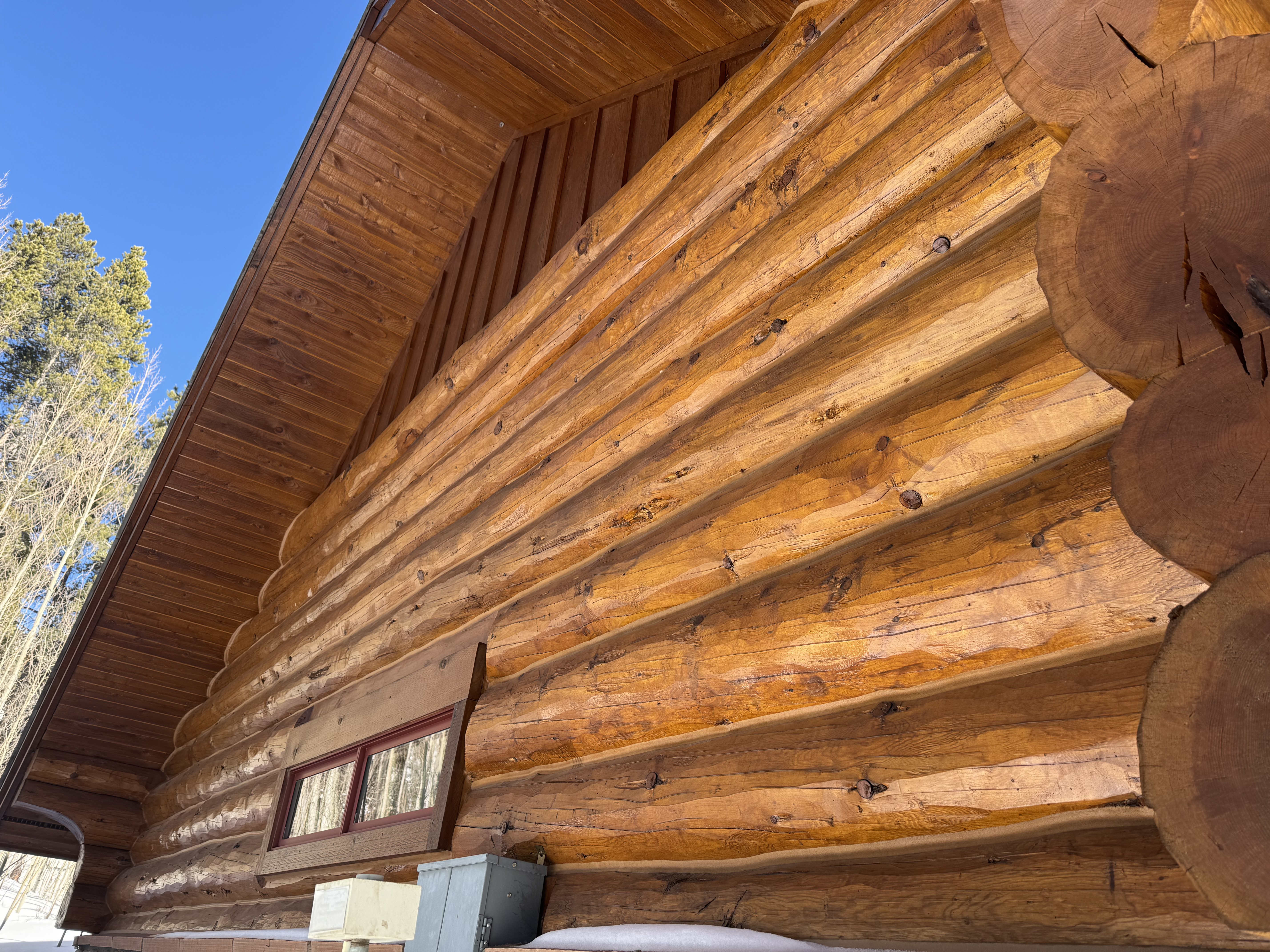 Media blasting mountain log home in Colorado