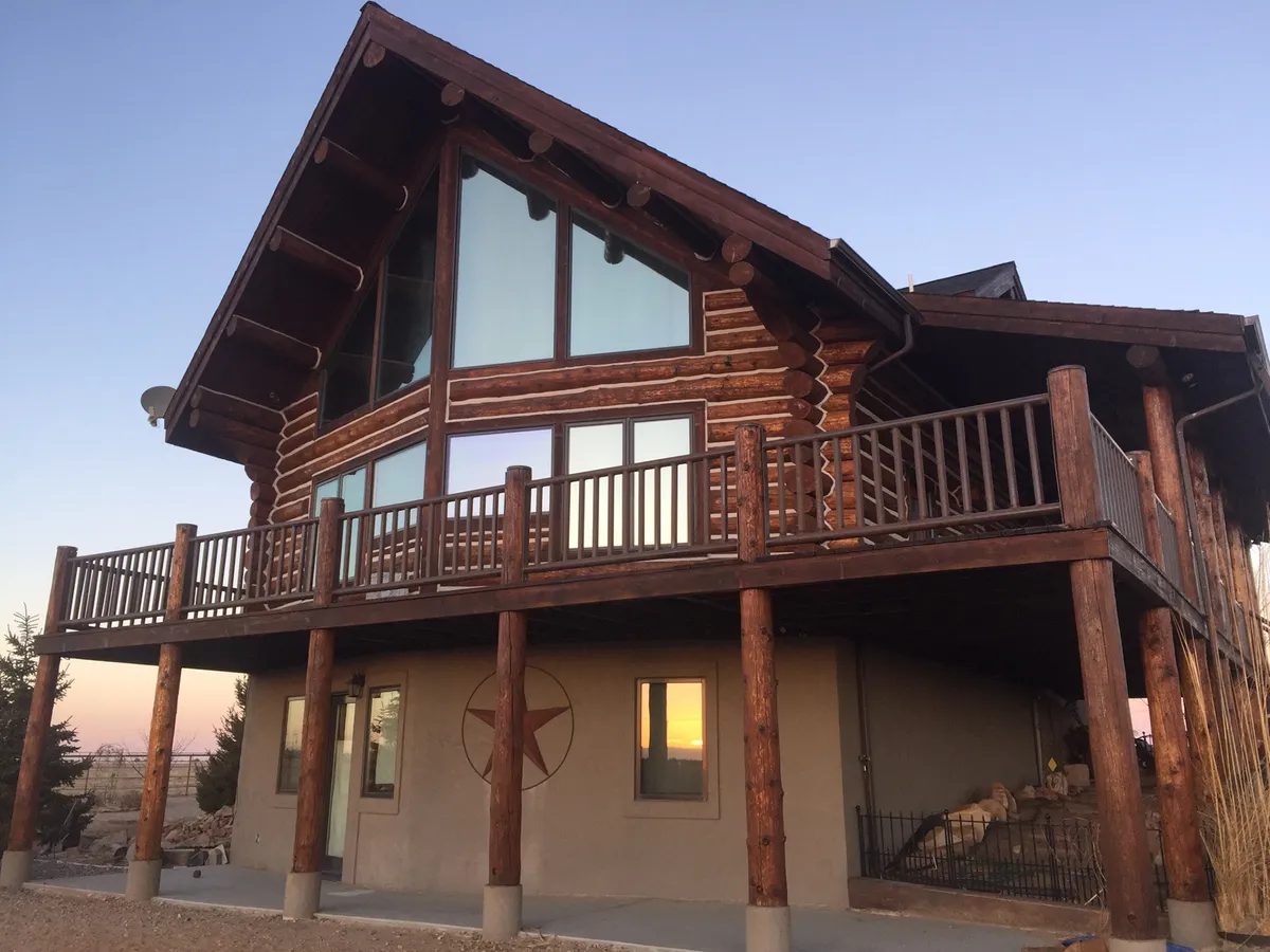 Expert log home chinking application showing Permachink and Sashco synthetic elastomer systems for weatherproof sealing in Colorado